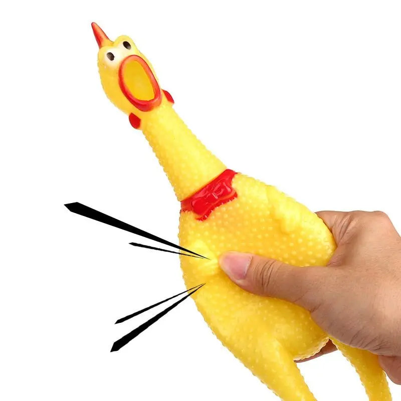 Main tenant un jouet jaune pour chien avec nez rouge - Jouets couineurs, jouets couineurs jetables, couineurs jetables