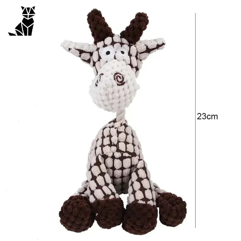 Gros plan d’une girafe en peluche de forme dâne sur une surface blanche, jouet d’éveil pour enfants