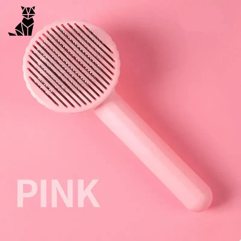 Peigne à chat - Design ergonomique, toilettage essentiel : Brosse rose pour enlever les poils morts sur fond rose